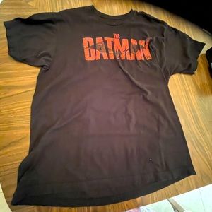 A Batman T-shirt, black in color, an XL
